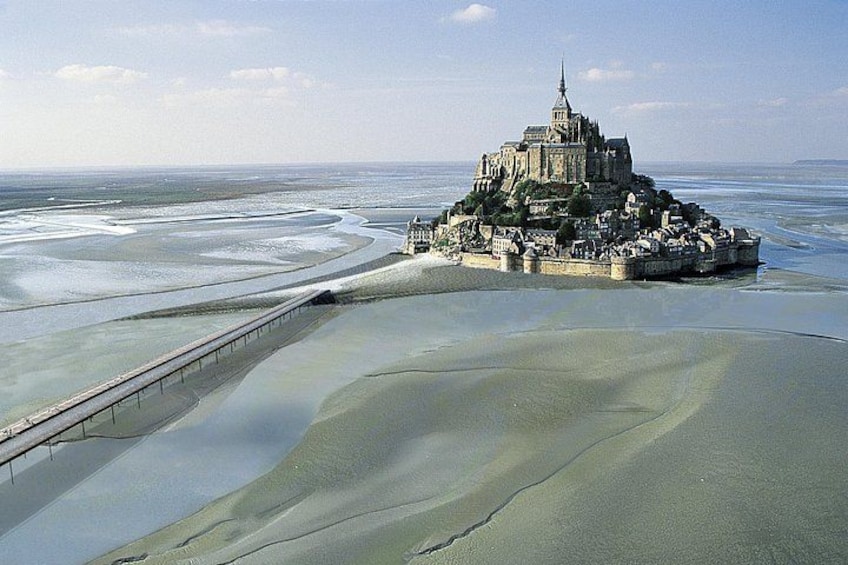 A coastal castle surrounded by water. 1