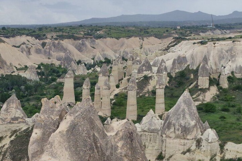 A landscape with numerous tall, pointed rock formations. 4
