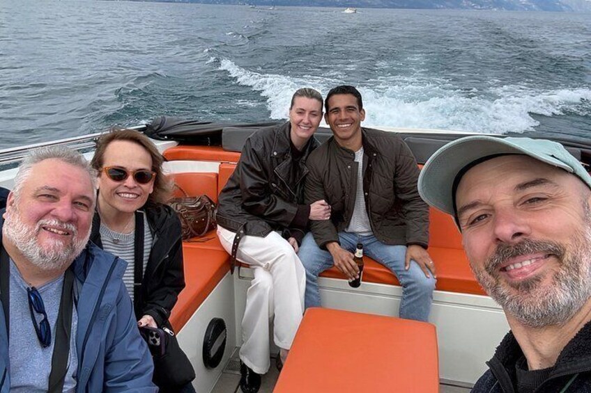 A group of people on a boat with an ocean in the background. 4