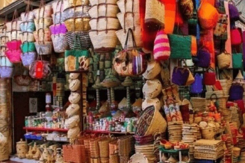 A market stall with various woven baskets and bags. 4