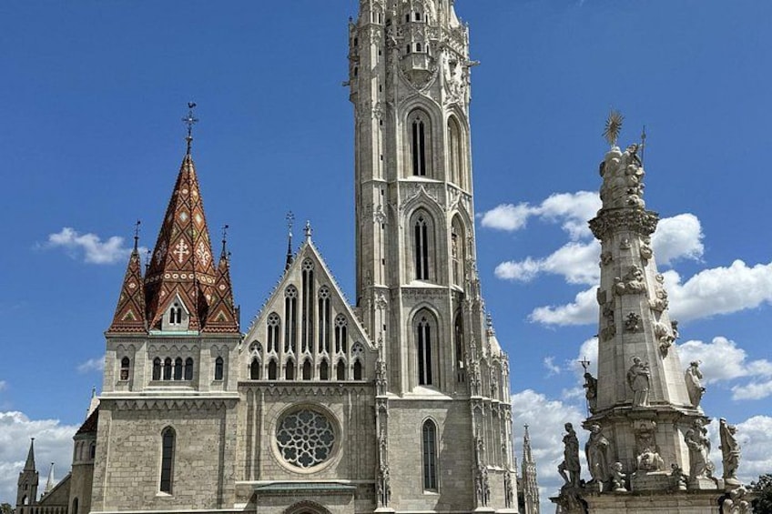 A Gothic cathedral with a tall tower and a spire. 5