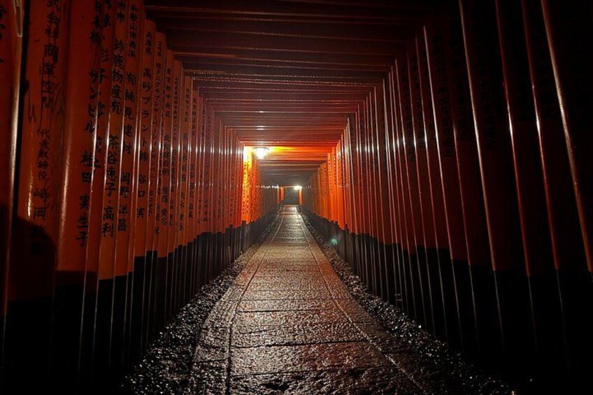 A corridor with orange pillars and a reflective floor. 2