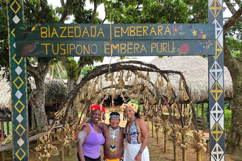 A traditional structure with a signboard displaying names in a local language. 4