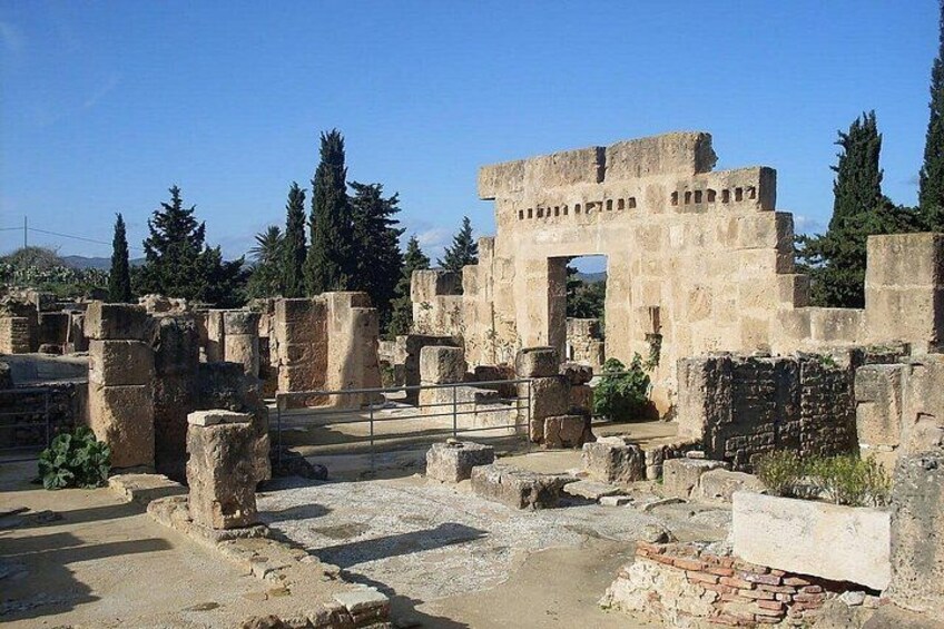 Ancient ruins with stone structures and columns. 2