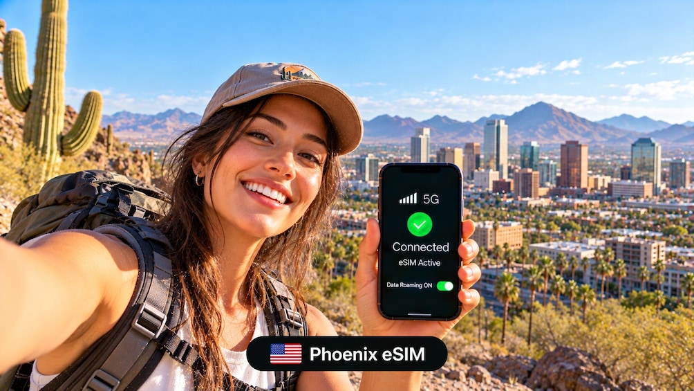 A person holding a smartphone displaying a 5G connection status with a cityscape in the background. 2