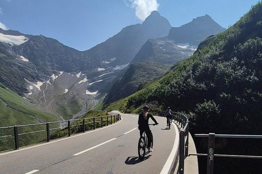 Alpine Pass Descent: Downhill Cycling Adventure in the Swiss Alps 1