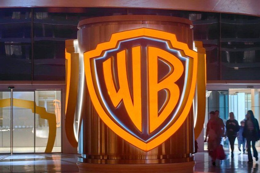 A large WB logo on a cylindrical structure. 2