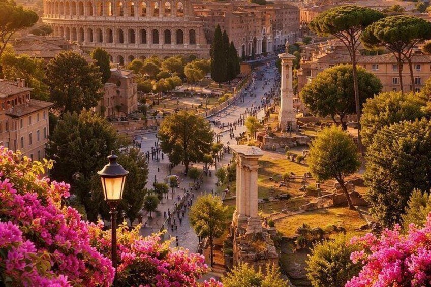 The Colosseum in Rome surrounded by trees and flowers. 3