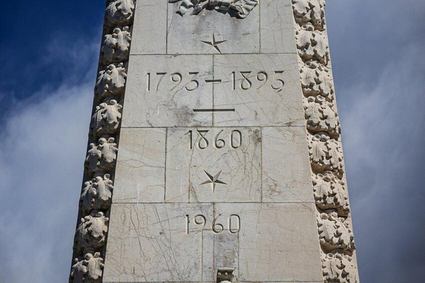 A monument with dates 1793-1893, 1860, and 1960 inscribed on it. 4
