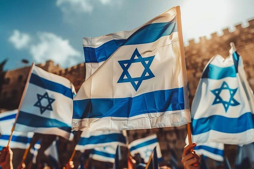 Multiple Israeli flags being held up by people. 1
