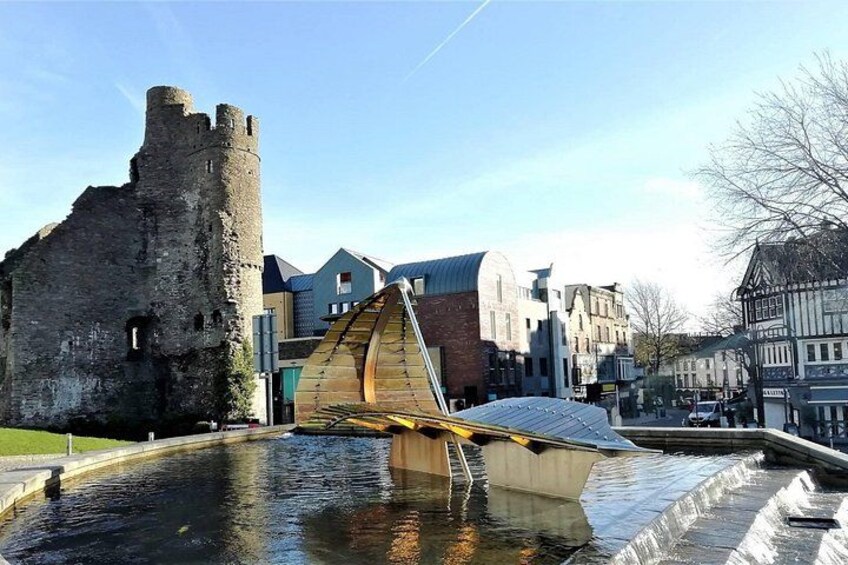 A historic castle, a modern bridge, and traditional buildings. 2