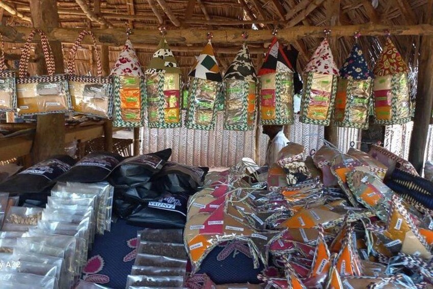 A market stall with colorful bags and textiles. 3