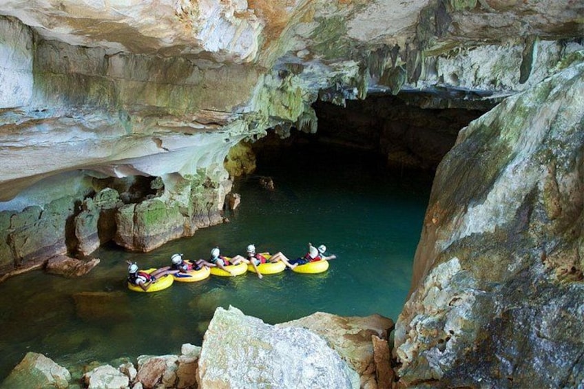 A group of people kayaking in a cave. 1