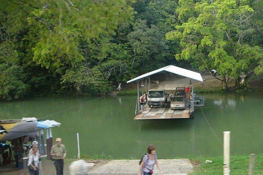 A floating dock with vehicles and people. 3