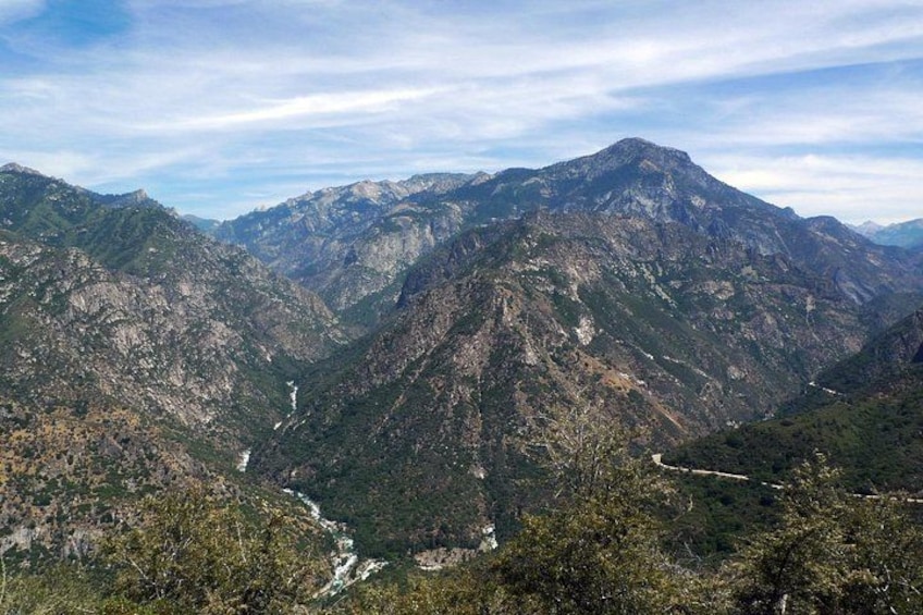 A mountainous landscape with a river flowing through a valley. 2
