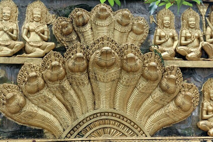 Golden Naga Relief on a Temple Wall in Cambodia 3