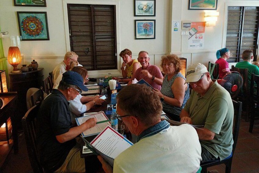 Happy tourists dining together in a Sihanoukville restaurant 2