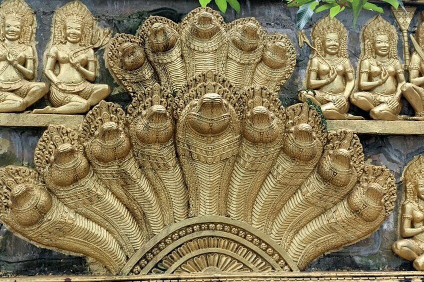 Golden Naga Relief on a Temple Wall in Cambodia 3