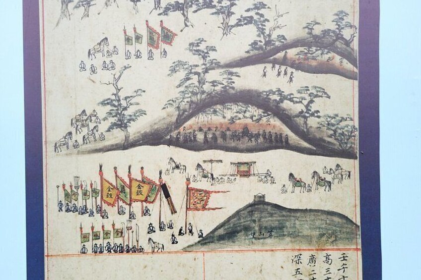 Un paisaje tradicional japonés con un árbol grande, una colina y banderas. 3