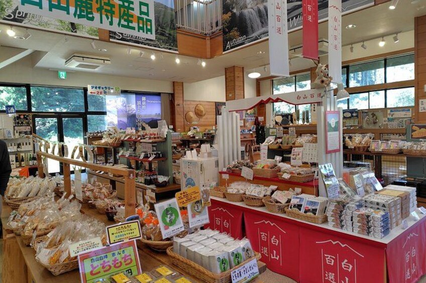A store with various products on display, including packaged goods and baskets. 2