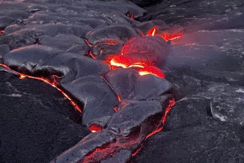 A volcanic landscape with flowing lava. 2