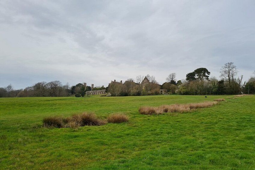 A green field with a building in the distance. 3