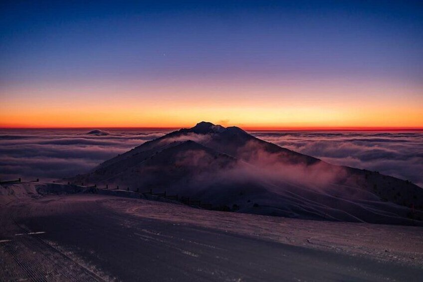 A mountain range at sunset with a clear sky. 3