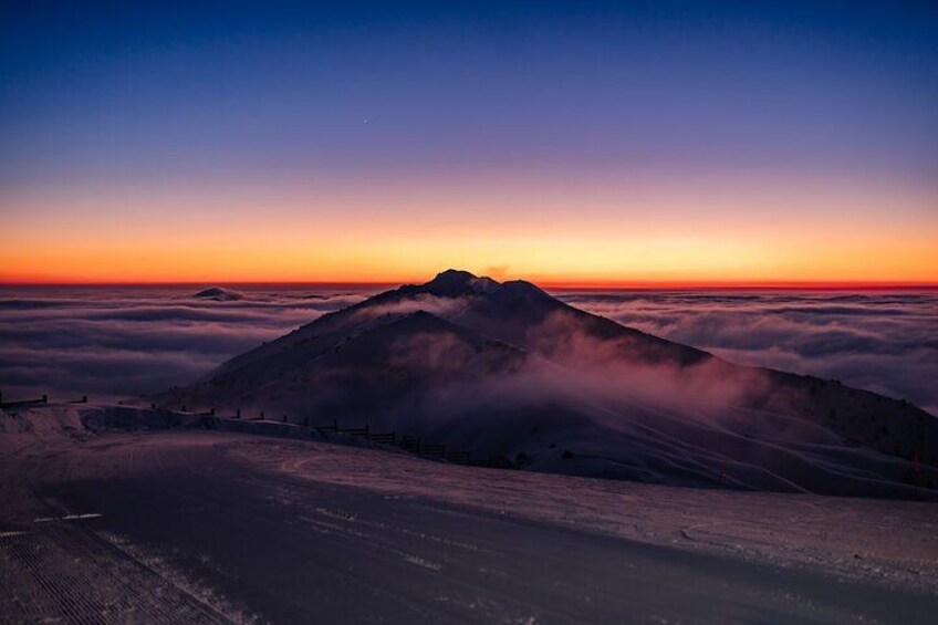 A mountain range at sunset with a clear sky. 3
