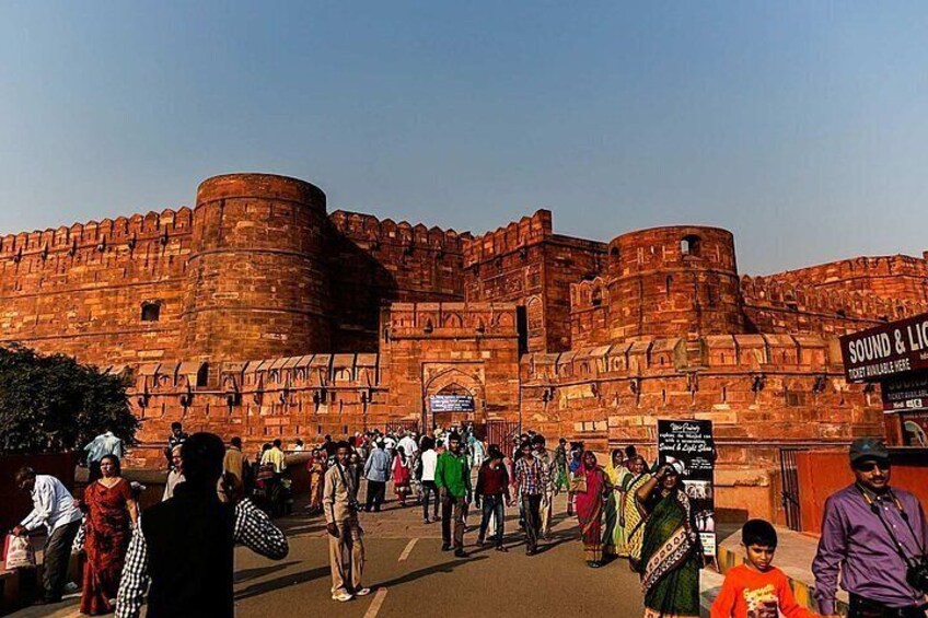 A historic fort with tourists in front. 3