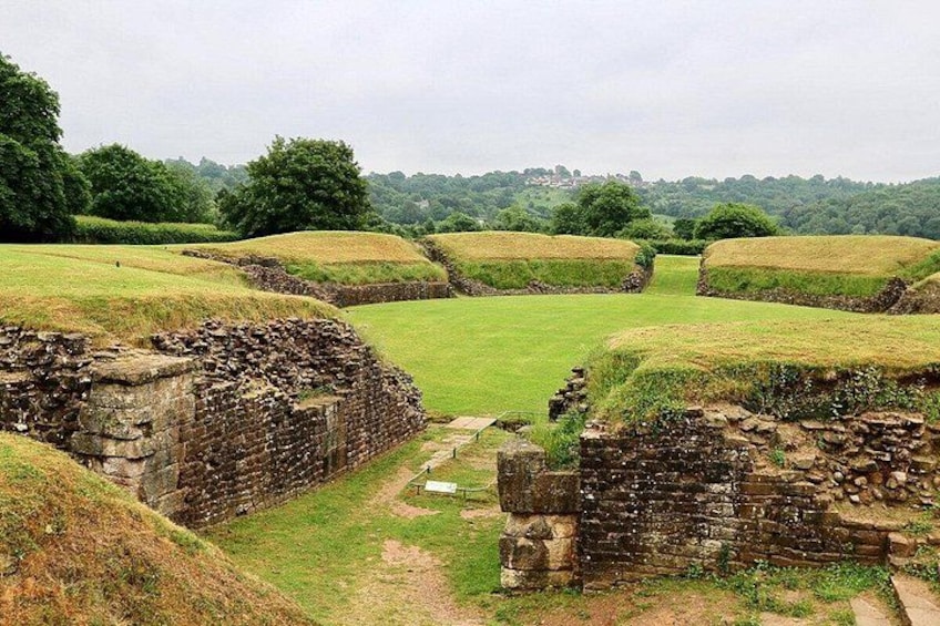Ancient stone walls and grassy fields. 4