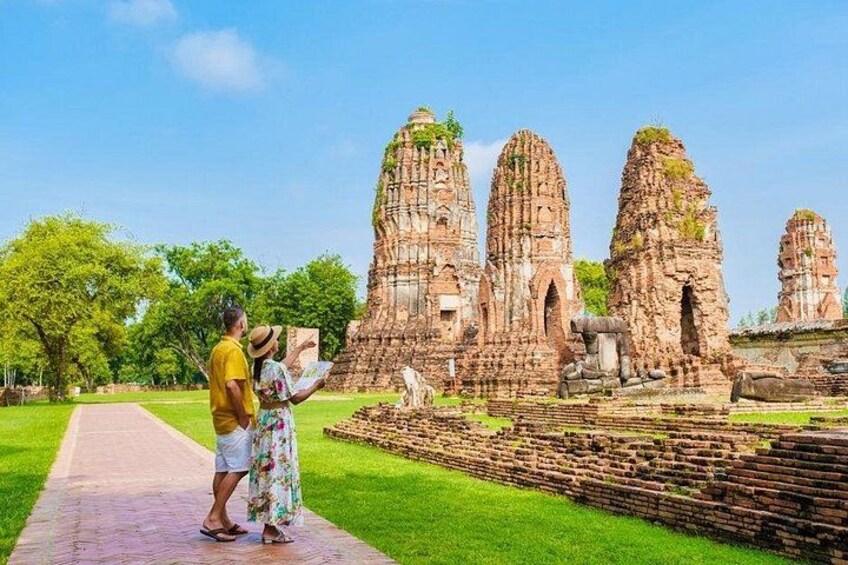 A temple complex with multiple tall, tiered structures. 5