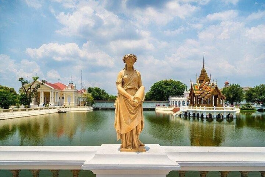 A statue, a temple, and a body of water. 2