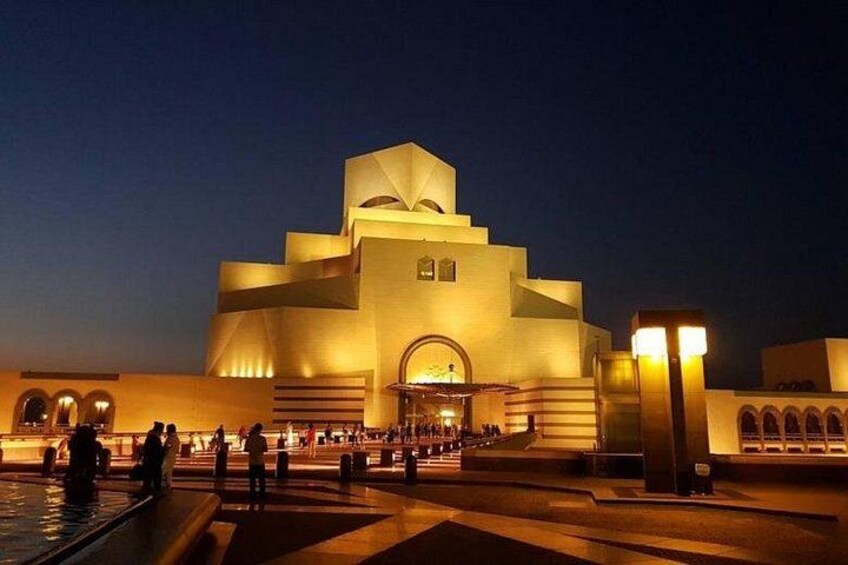 A modern building with a unique architectural design, featuring a large central dome and multiple smaller domes. 5