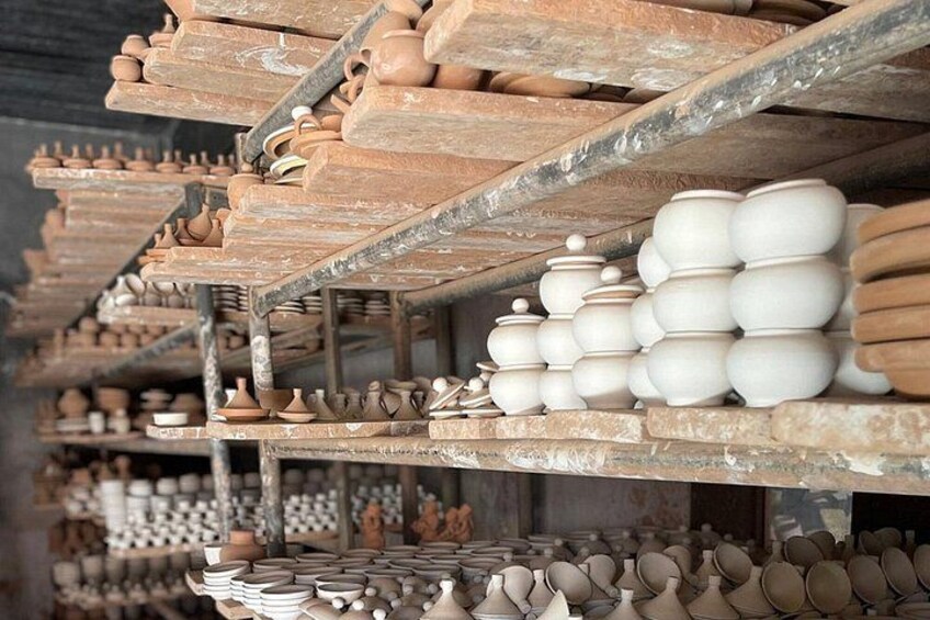 Shelves filled with pottery items. 4
