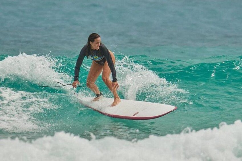A person surfing on a wave in the ocean. 2