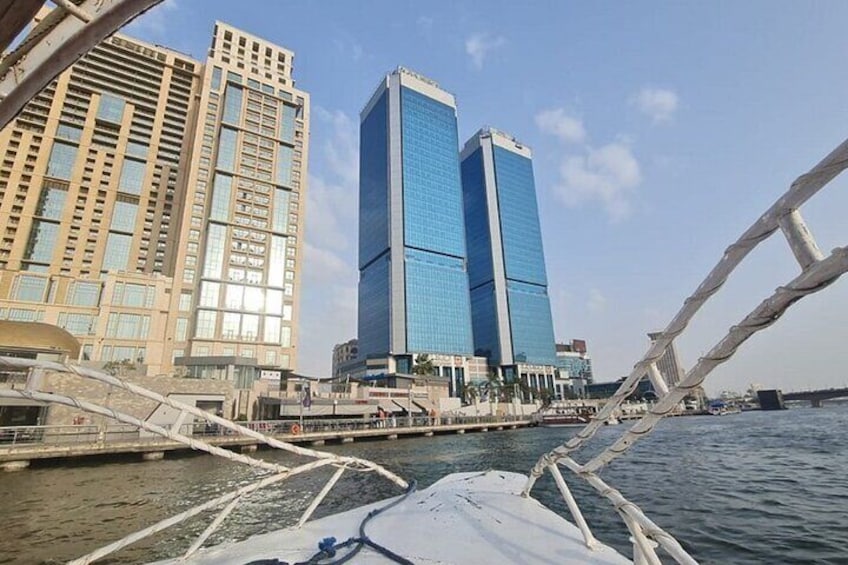 A river with a bridge and two modern buildings. 2
