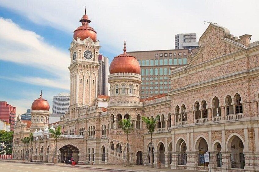 A historic building with domed towers and arched windows. 4