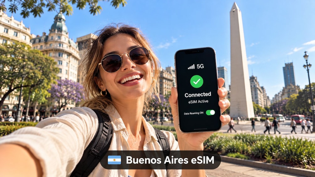 A person holding a smartphone displaying a 5G connection status with a green checkmark, standing in a public square with a monument in the background. 3