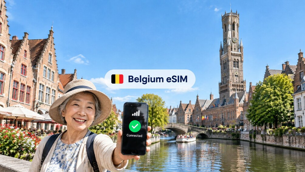 A person holding a smartphone with a connected eSIM logo, a canal, and historic buildings in the background. 1