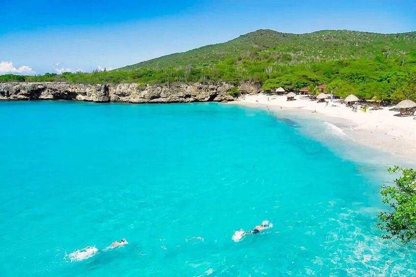 Kleine Knip, is a serene bay on the southwest coast of Curaçao, surrounded by rocky cliffs and lush greenery. The calm turquoise waters provide a peaceful spot for swimming and snorkeling 1