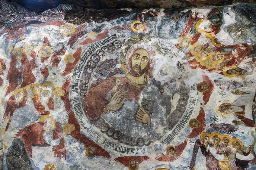 A mosaic with religious figures, geometric patterns, and inscriptions. 4