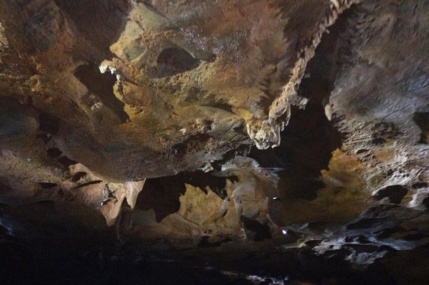 A cave interior with stalactites and stalagmites. 2