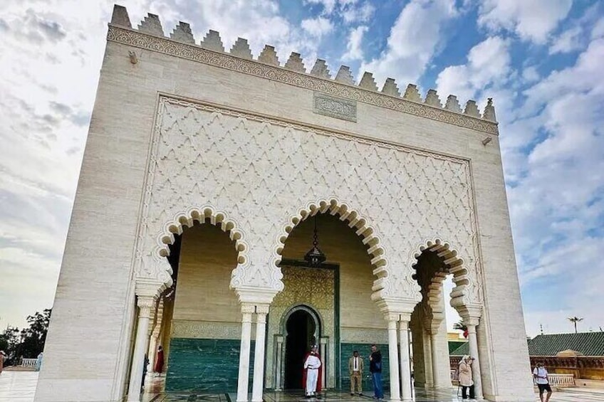 A large, ornate gate with three arches and intricate patterns. 2