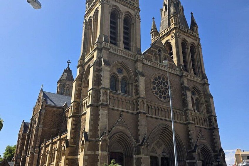 A large, historic church with a prominent tower and arched windows. 2