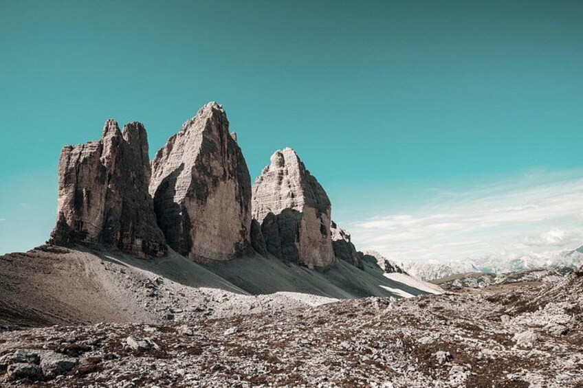 A mountainous landscape with rocky peaks and a clear sky. 4