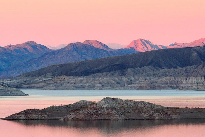 A lake with mountains in the background. 3
