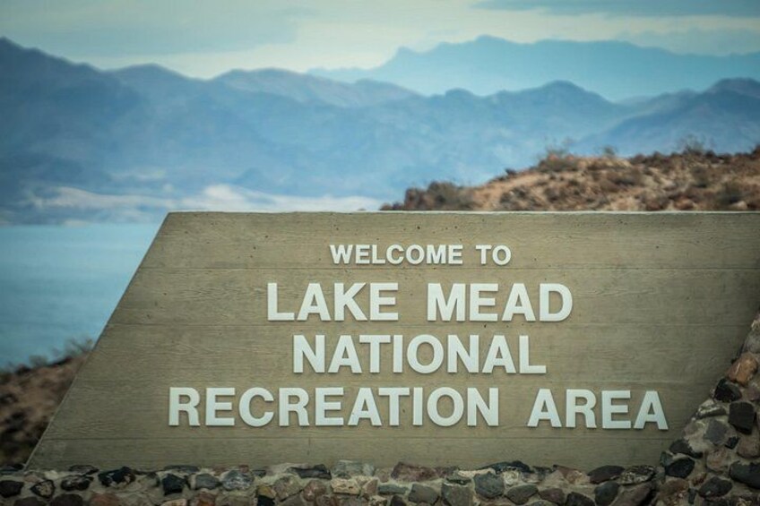 A welcome sign at Lake Mead National Recreation Area with a mountainous backdrop. 5