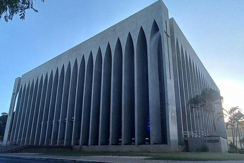 A large, modern building with a series of tall, pointed windows. 3