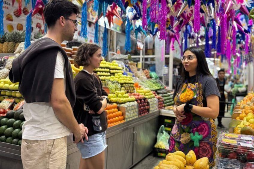 A market with fresh produce and colorful decorations. 1