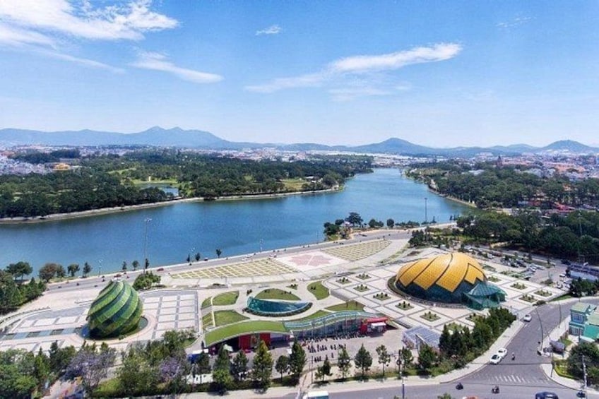 A river, a stadium, and a park with a large dome. 1